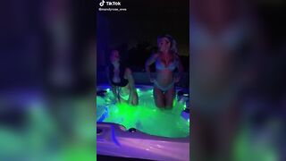 Mandy and her friend in her jacuzzi