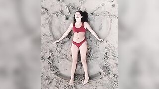 Isabela Merced: Making sand angels #4