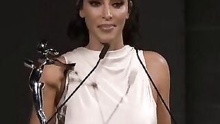 Her nips erect while holding a speech.